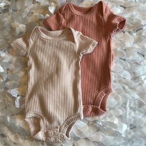 Carter’s newborn onesies. Brand new never worn. Washed once in Dreft.